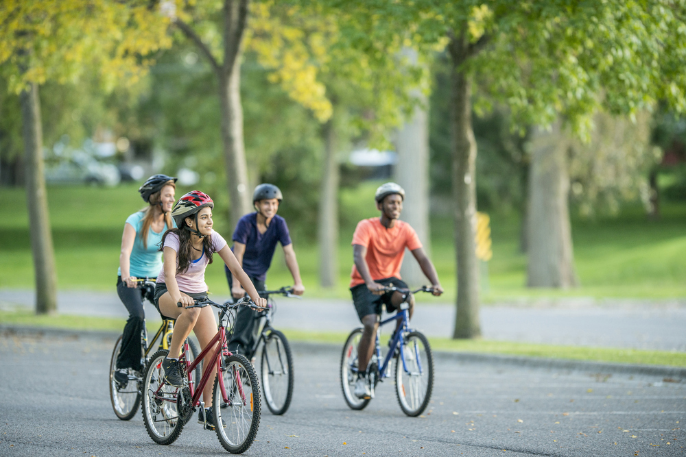 4 teenagers riding bikes